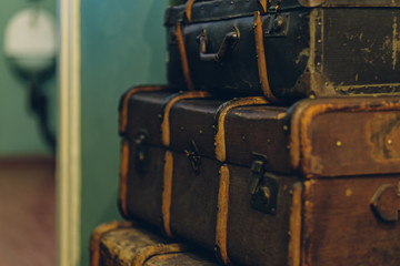 a pile of old suitcases form of the tower design concept