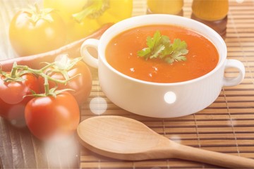 Bowl of gazpacho or tomato soup with ingredients