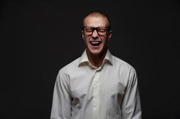 Laughing positive young guy office worker