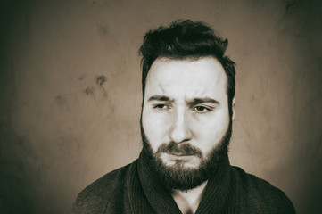 Fototapeta premium Black and white portrait of a sadness man with headache.
