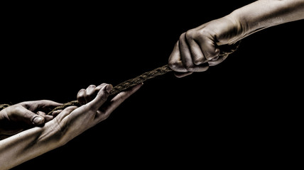 Hand holding a rope, climbing rope, strength and determination. Rescue, help, helping gesture or...