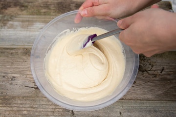 Mixing raw dough in bowl. Baking cake, muffin or homemade pastry.