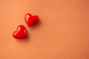 Obraz premium Valentines day concept. Two red hearts on colorful background. Copy space.