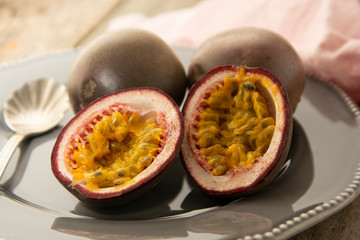 Passion fruits on wooden background. Healthy eating.