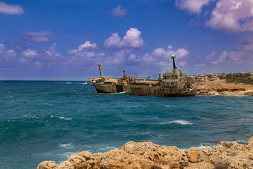 Shipwreck. Sunken ship on the rocks near the shore