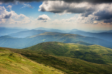 Summer landscapes of the Carpathian Mountains, with high mountain lakes and after thunderbolt rainbows.