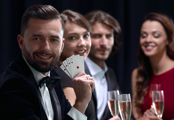 Handsome man playing in casino
