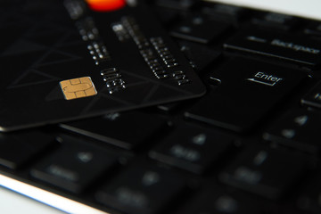 Credit card on a computer keyboard, close-up. Internet purchase