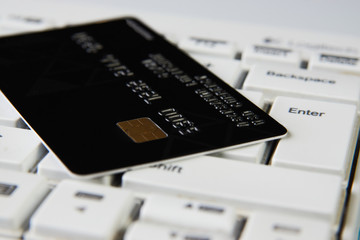 Credit card on a computer keyboard, close-up. Internet purchase