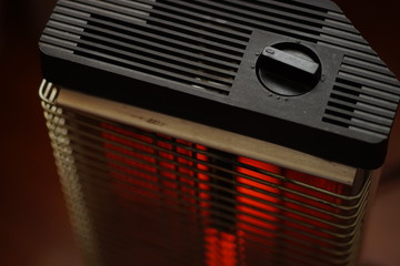 Vintage electric heater Ugolek with a burning lamp rod