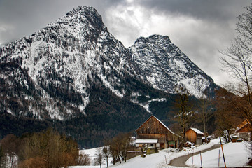 A wooden building in snowy mountains in Austria. Winter Alps.