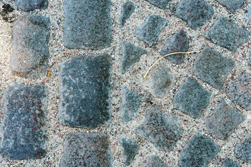 Cobblestones on the road. German paving stones. Neat paving stone.