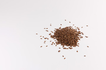 pile of flax seeds isolated on white background