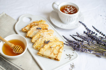 Homemade Pancakes with Honey, Tea, Lavender Flowers, Easy Food Concept Breakfast 