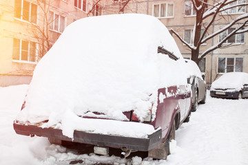 Cars covered with fresh white snow