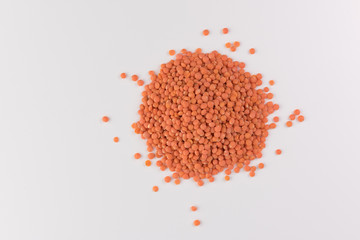 pile red lentils isolated on white background, top view