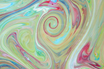 Fototapeta na wymiar Abstract colorful background. Fine art in green color. Multicolored pattern on the liquid. Colored paint stains in the liquid. Art