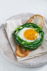 Green beans with sunny side fried egg on toast