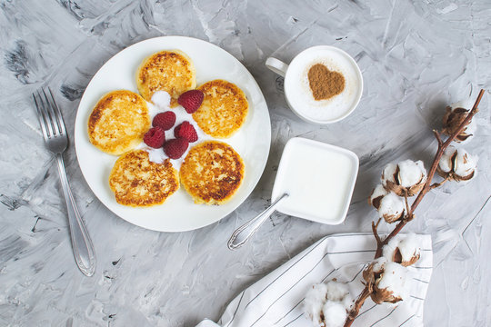 White Cup of Coffee Cappuccino with Heart Pattern of Cinnamon, Cottage Cheese Pancakes with Raspberries, Healthy Breakfast, Traditional Food, Valentines Day