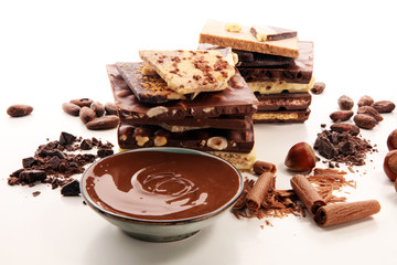Chocolate bars on table with chocolate tower.