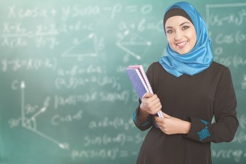 Young woman muslim notebooks looking at camera make up blue