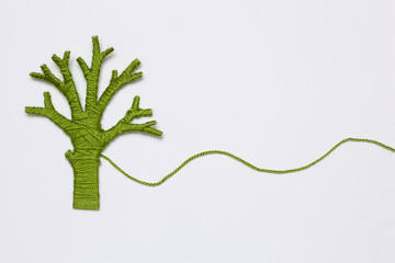 green yarn tree isolated on white. Eco concept