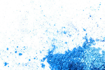 Crushed eye shadow on white background. Macro