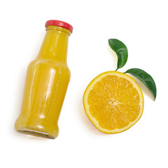 Delicious orange juice in a bottle and slice of orange next to it. Isolated on white. Top view