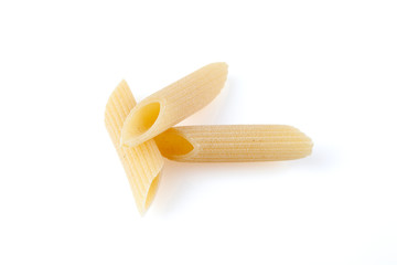 Raw feathers macaroni. Italian pasta close up on the white background