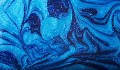 Abstract blue nail polish background. Close-up image