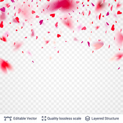Heart shaped pink red confetti blurred in motion.