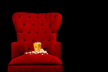 popcorn in red sofa - obrazy, fototapety, plakaty