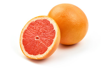 Half of Citrus Fruit. Ripe Juicy pink grapefruit, close-up, isolated on a white background