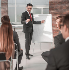 businessman explaining business to the team the new strategy of the company