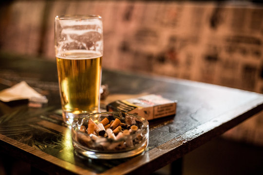 beer and cigarettes on the table
