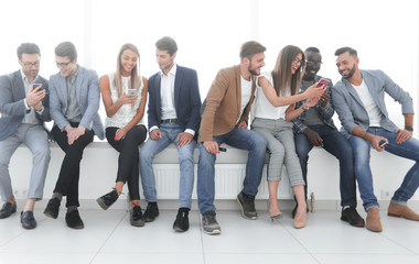 Fototapeta premium group of young people communicate in the waiting room.