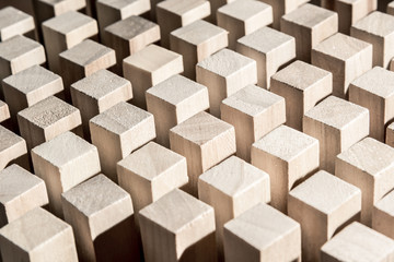 Risk and strategy in business, many identical wooden blocks