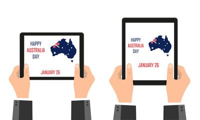 The mainland of Australia, in the colors of the Australian flag, is depicted in mobile devices that are held in their hands. Festive day of Australia. January 26