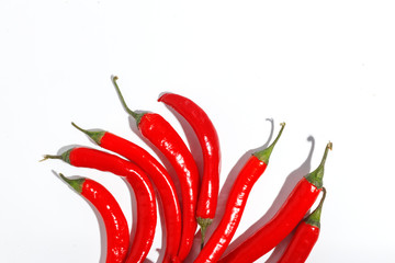 Red hot chili peppers on white background.