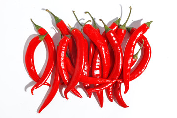 Red hot chili peppers on white background.