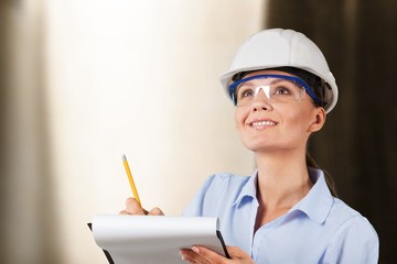 Portrait of young student of architecture  on background