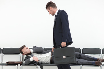 businessman talking to a tired visitor