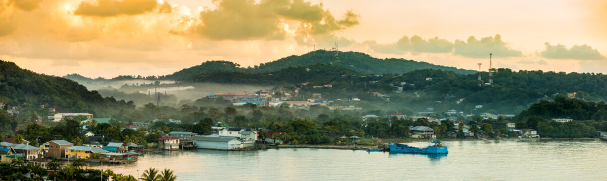 Panorama of Coxen Hole, Roatan with fog in first morning light.