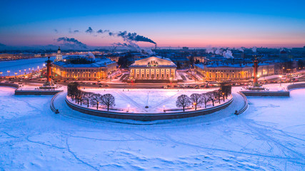Saint Petersburg. Russia. Vasilyevsky Island. Rostral columns. City center. Winter in Petersburg. Panorama of the city. River Neva in winter. Travel to Russia.