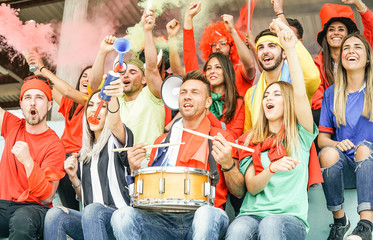 Football supporter fans watching international soccer match - Young group of excited friends having fun exulting at world game at stadium - Youth, sport and celebration score concept