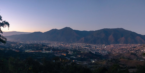 Panoramic view of Caracas in a sunny and beautiful day. you can see the Avila Mountain and the city at its foot as well as the surrounding hills