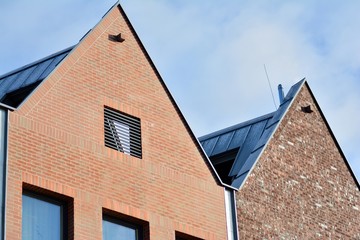 Modern apartment buildings on a sunny day with a blue sky. Facade of a modern apartment building