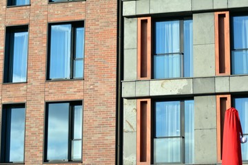 Modern apartment buildings on a sunny day with a blue sky. Facade of a modern apartment building
