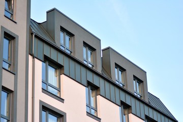 Modern apartment buildings on a sunny day with a blue sky. Facade of a modern apartment building