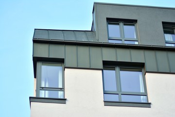 Modern apartment buildings on a sunny day with a blue sky. Facade of a modern apartment building